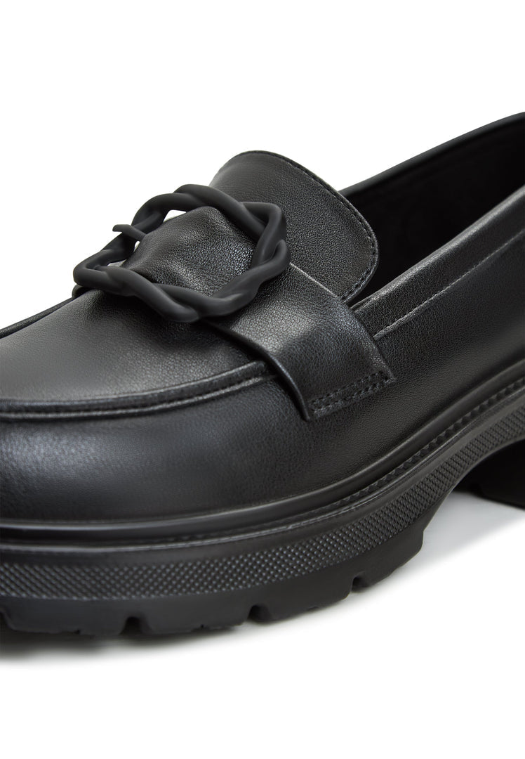 A fashionable pair of black platform loafers, perfect to match with a sari or any women's outfit for a stylish look.