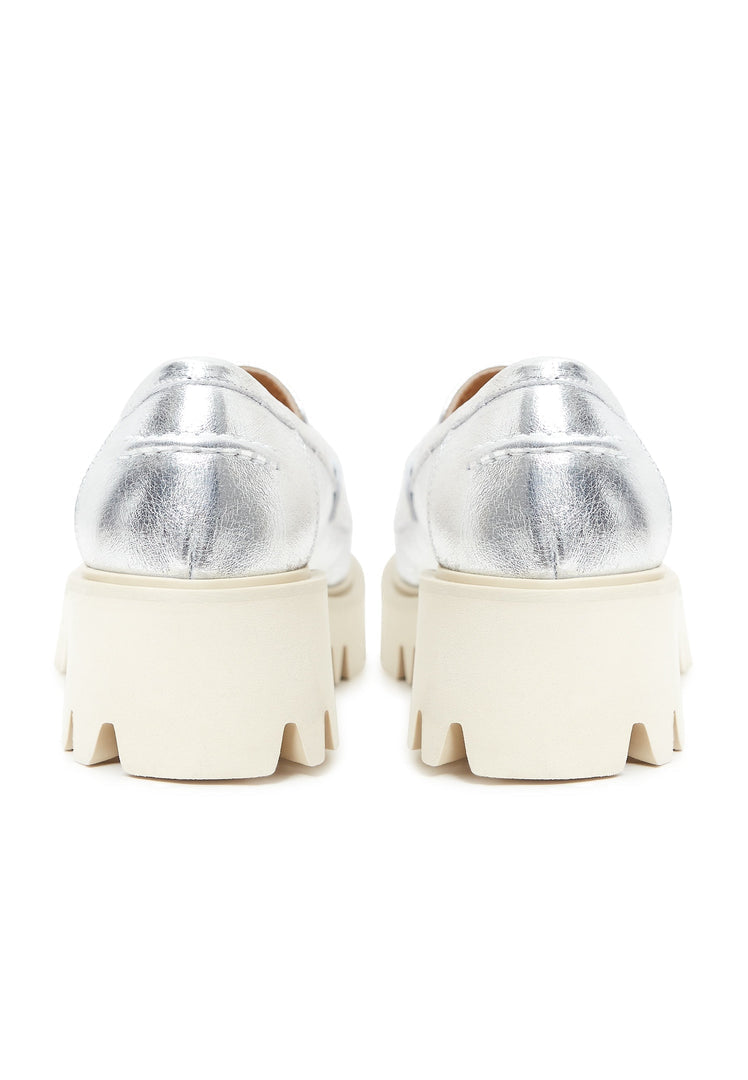 A trendy pair of chunky platform loafers in silver, perfect for fashion-forward women.