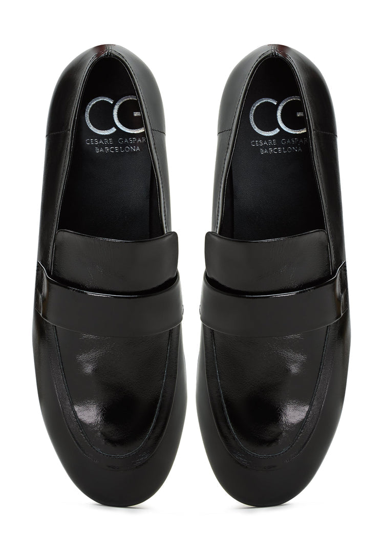 A stylish pair of black Diana block heeled loafers, perfect for women's fall fashion shoes.