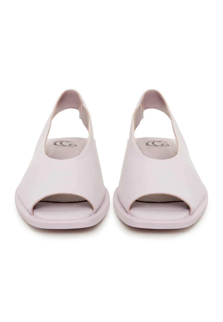 A pair of stylish flat sole violet women's sandals, perfect for summer and beach wear.