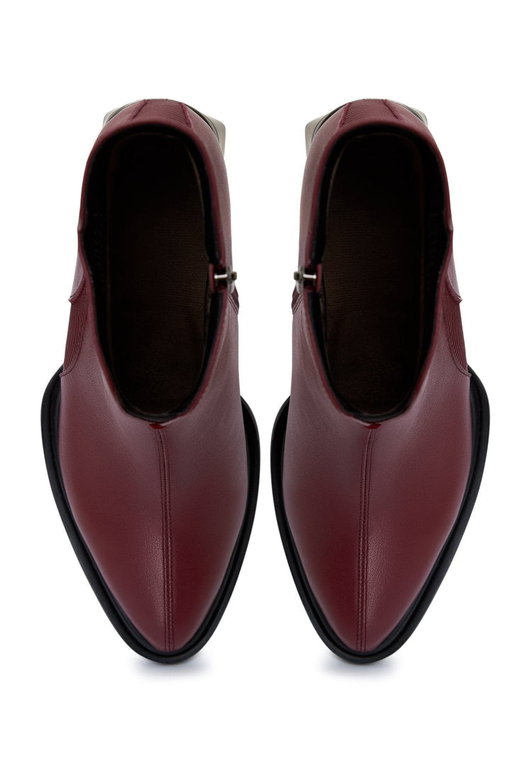 A stylish pair of bordeaux block heel ankle boots for women, perfect for fall fashion and a trendy look.