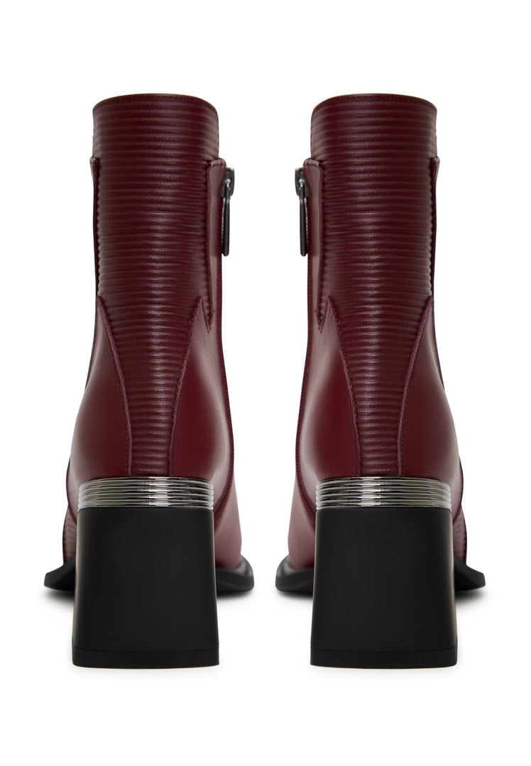 A stylish pair of block heel ankle boots in Bordeaux, perfect for fall fashion - trendy ankle boots for women built for comfort and style.