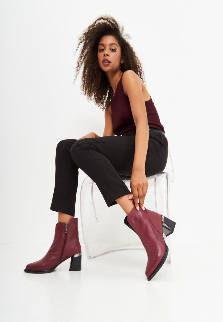 A stylish pair of Bordeaux block heel ankle boots, perfect for women's fall fashion - trendy and chic.