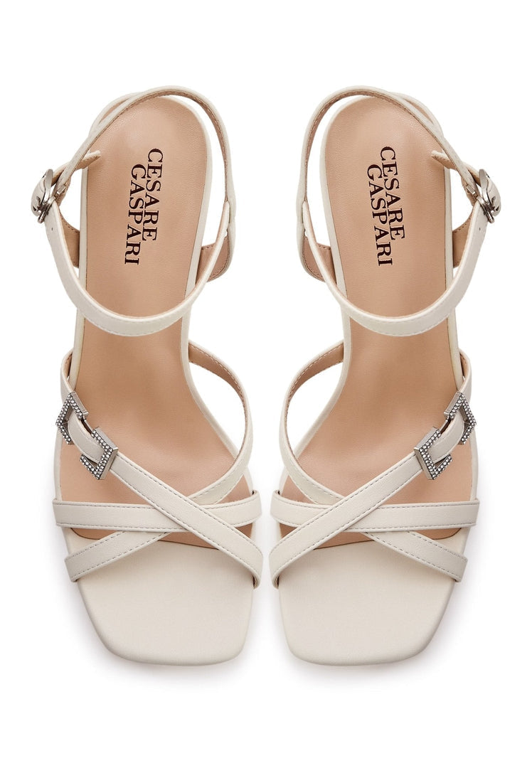 A stylish pair of beige sandals, perfect for elevating your summer footwear game. These trendy women's sandals are a must-have for the season.