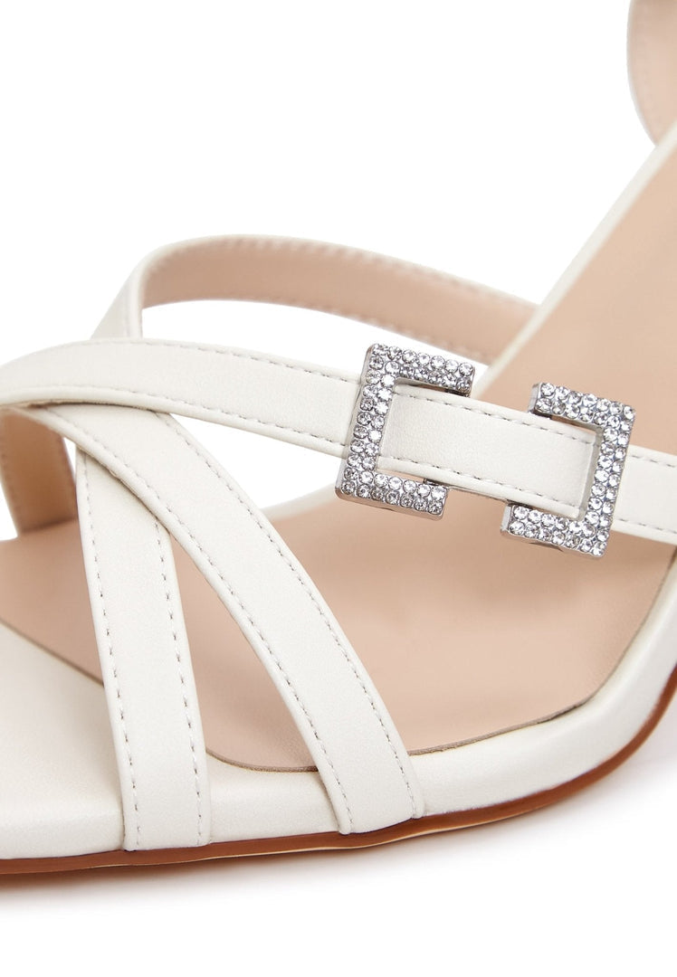 A pair of stylish beige sandals perfect for women to elevate their summer footwear with these trendy shoes.