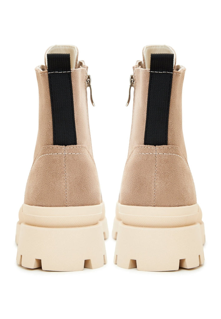 A pair of urban lace-up ankle boots, trendy ankle booties perfect for street style fashionistas.
