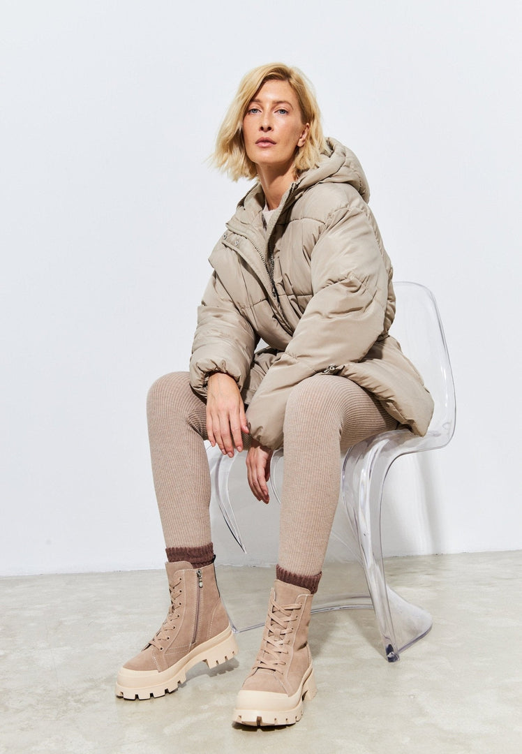 A pair of trendy urban lace-up ankle boots, perfect for fashionable street style outfits.