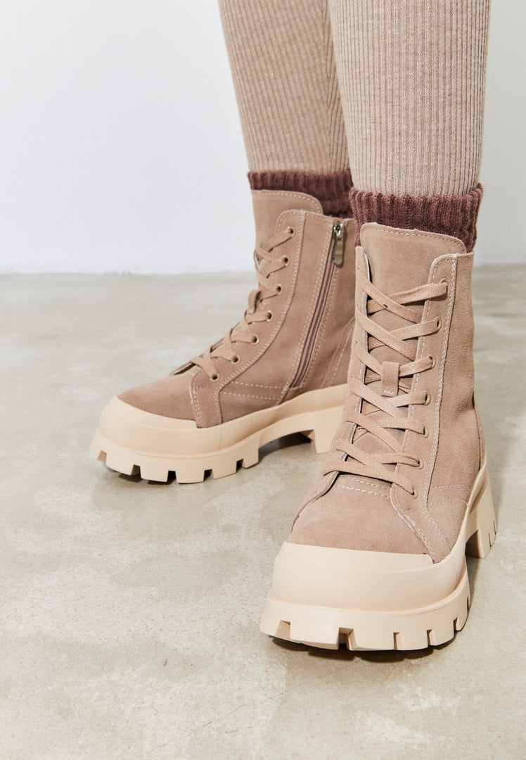 A stylish pair of urban lace-up ankle boots, perfect for trendy and chic street style.
