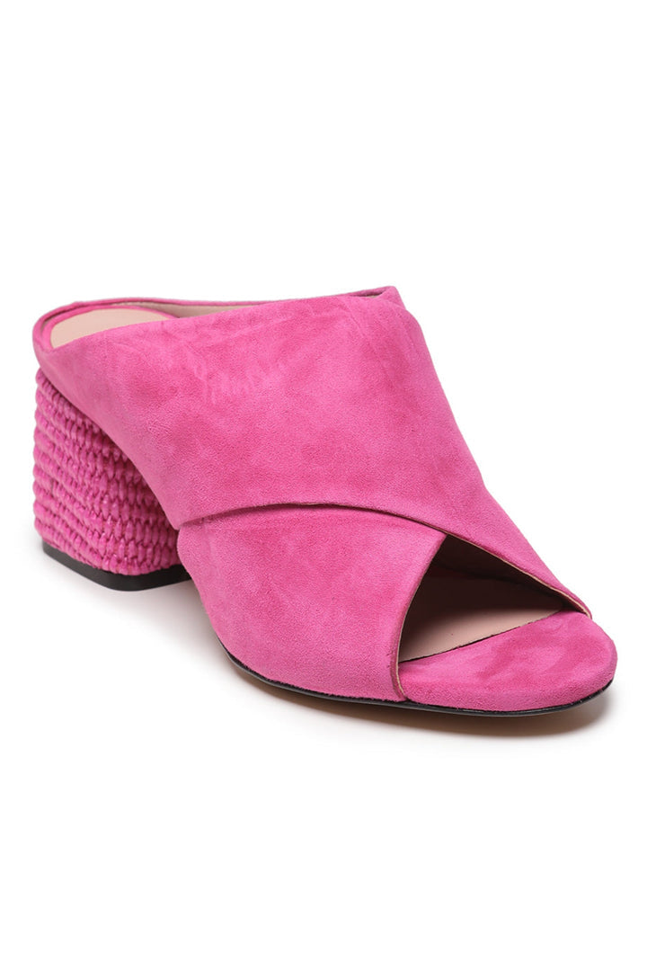 A stylish pair of fuchsia woven charm mules, perfect for summer fashion sandals for women.