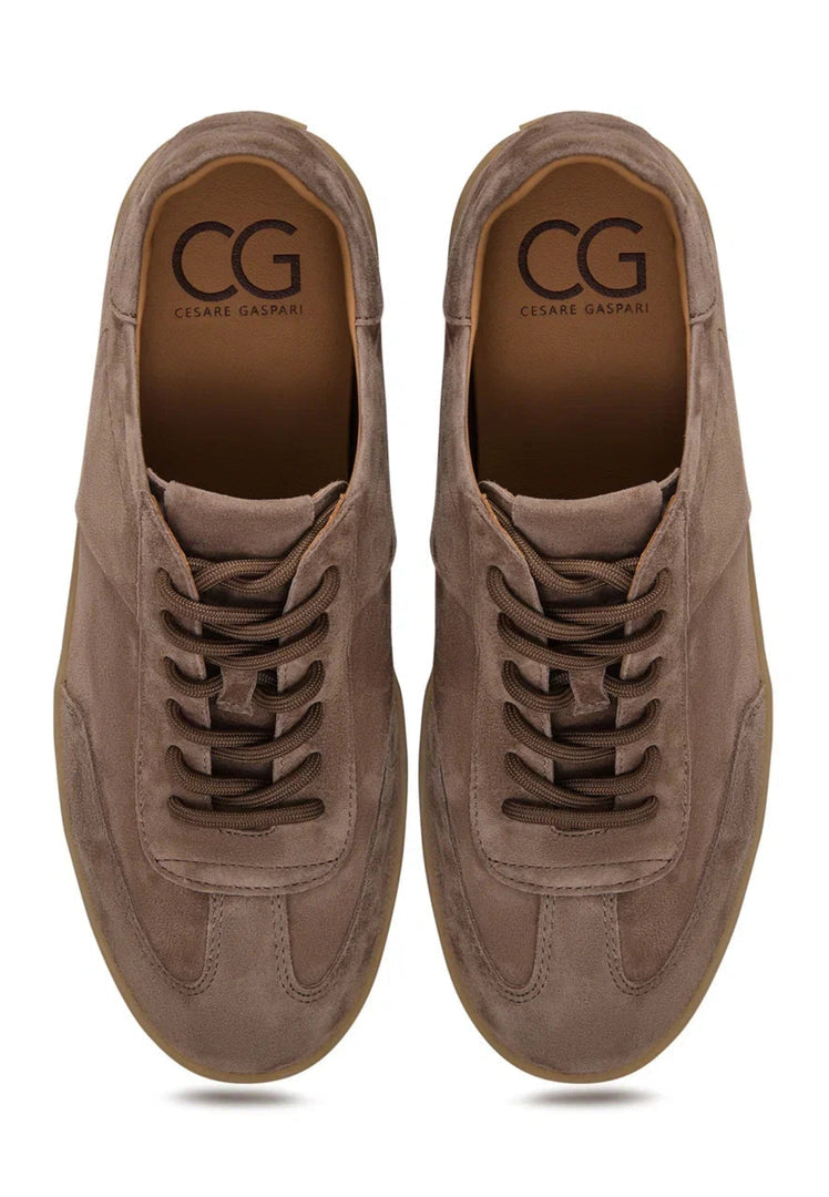 A pair of stylish low-top suede sneakers in classic beige color, perfect for footwear fashion enthusiasts.