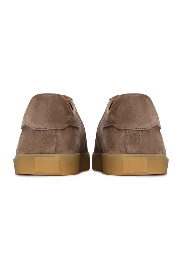 A stylish pair of beige low-top suede sneakers, perfect for adding a classic touch to your footwear fashion.