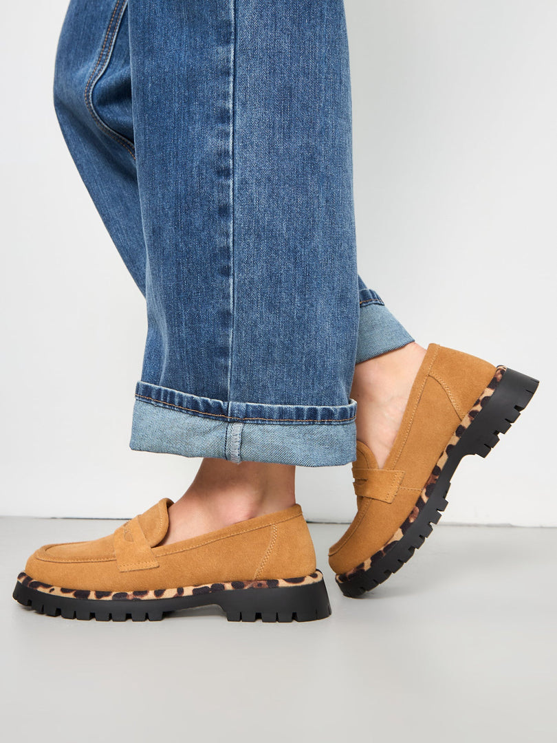 A trendy pair of Lily brown chic loafers with a chunky sole, perfect for women's fashion footwear.