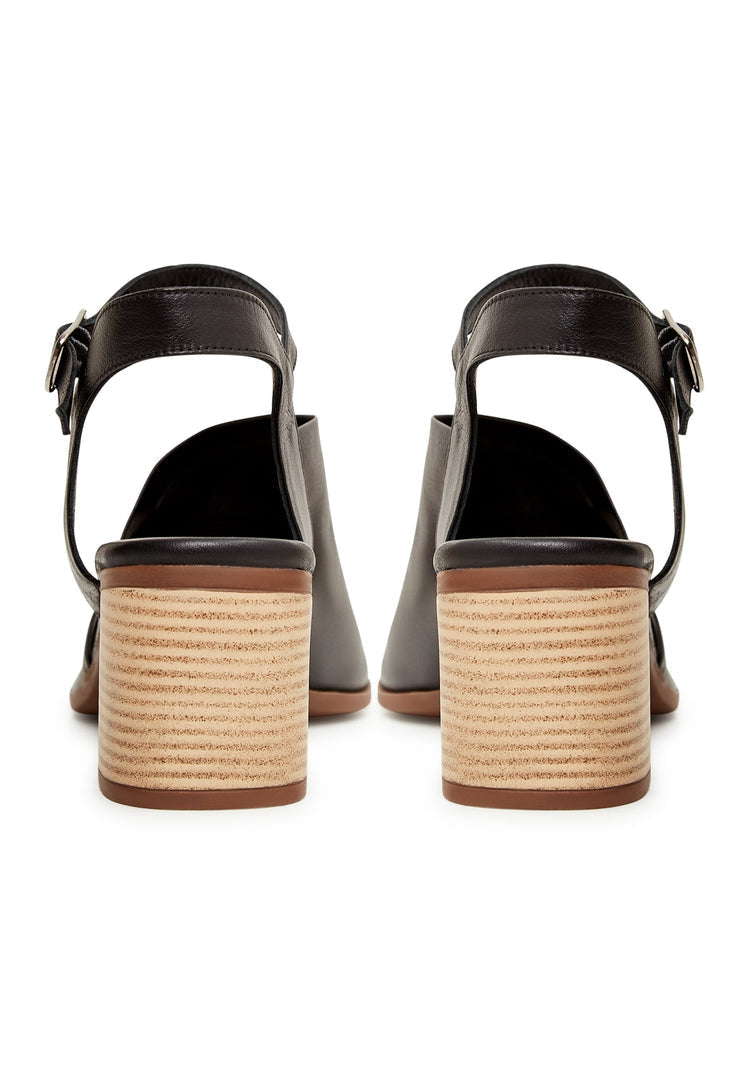 A stylish pair of black leather block heel sandals perfect for any occasion.