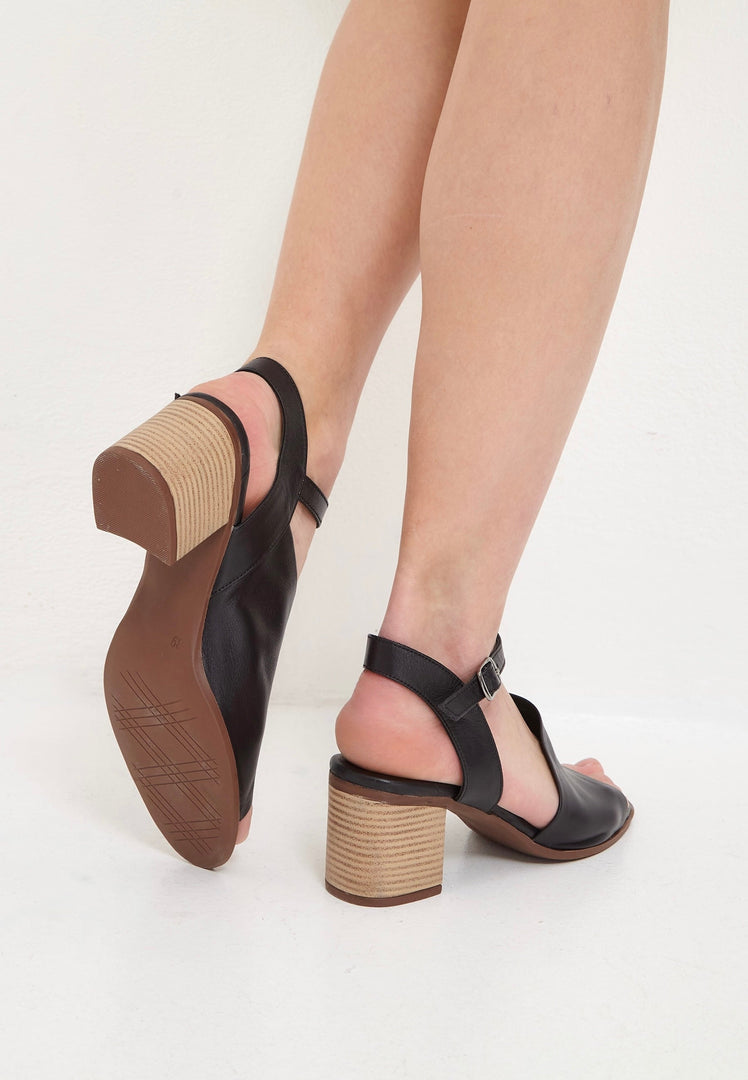 A chic pair of black leather block heel sandals, perfect for any occasion.