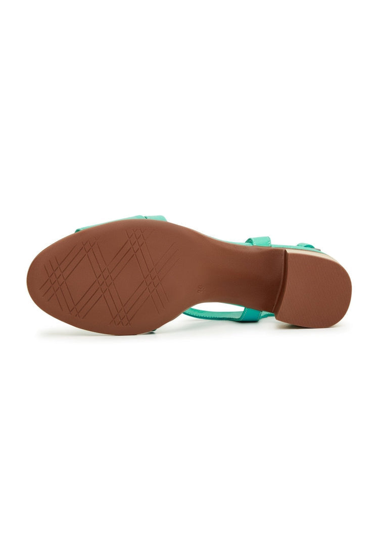 A stylish pair of green block heel sandals, perfect for casual outings.
