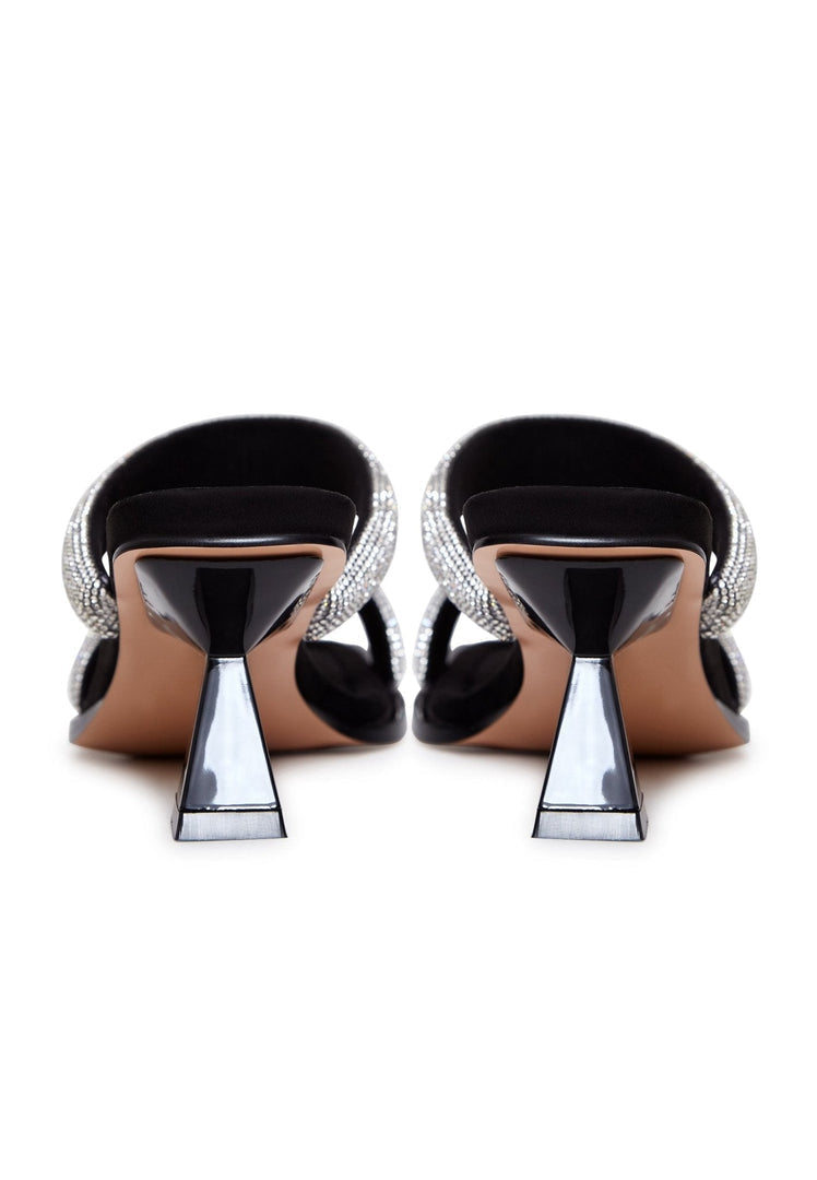 A stylish pair of black suede high heels with jewel embellishments, perfect for upscale events and special occasions, these women's designer suede sandals exude luxury and elegance.