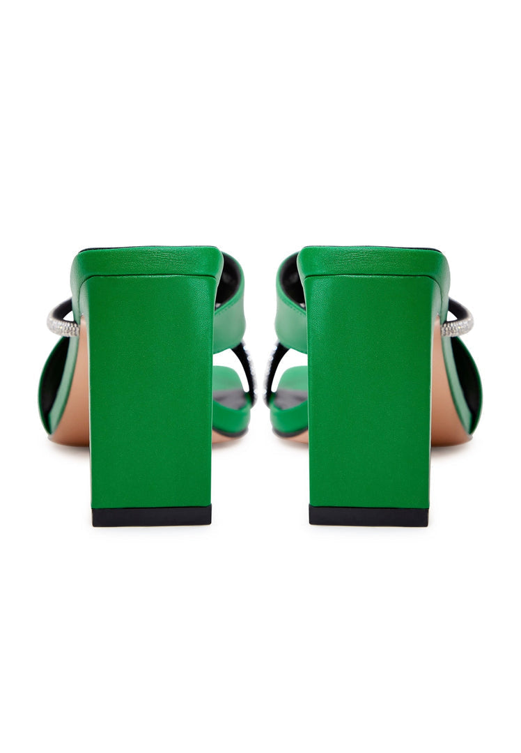A stylish pair of green strappy high heels sandals for women, perfect for the fashion-forward individual.