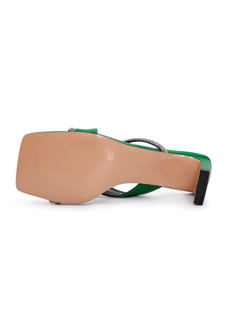A pair of stylish women's green high heels strappy sandals, perfect for adding a fashionable touch to any outfit.