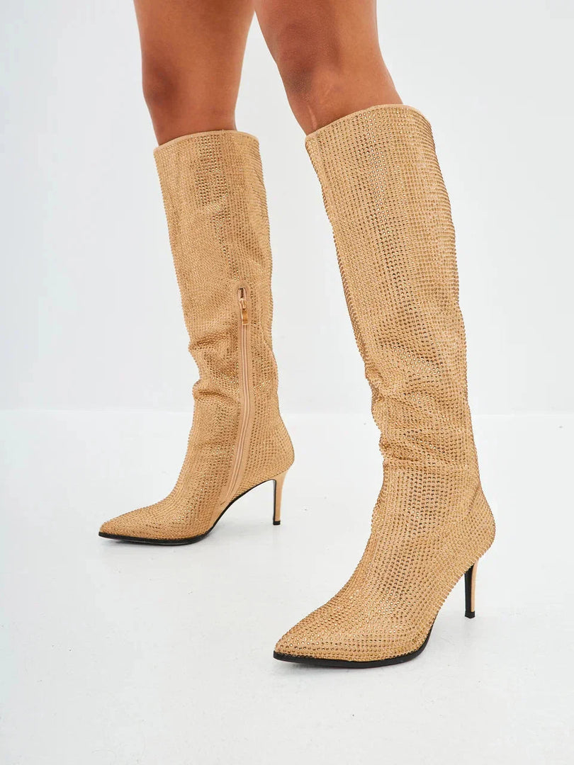 A stunning pair of Mili Jewel Stiletto Knee High Boots in gold, featuring exquisite jewel embellishments.