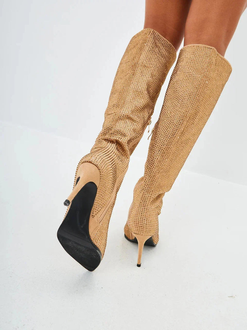 A stylish pair of Mili jewel stiletto knee high boots in gold with exquisite jewel embellishments.