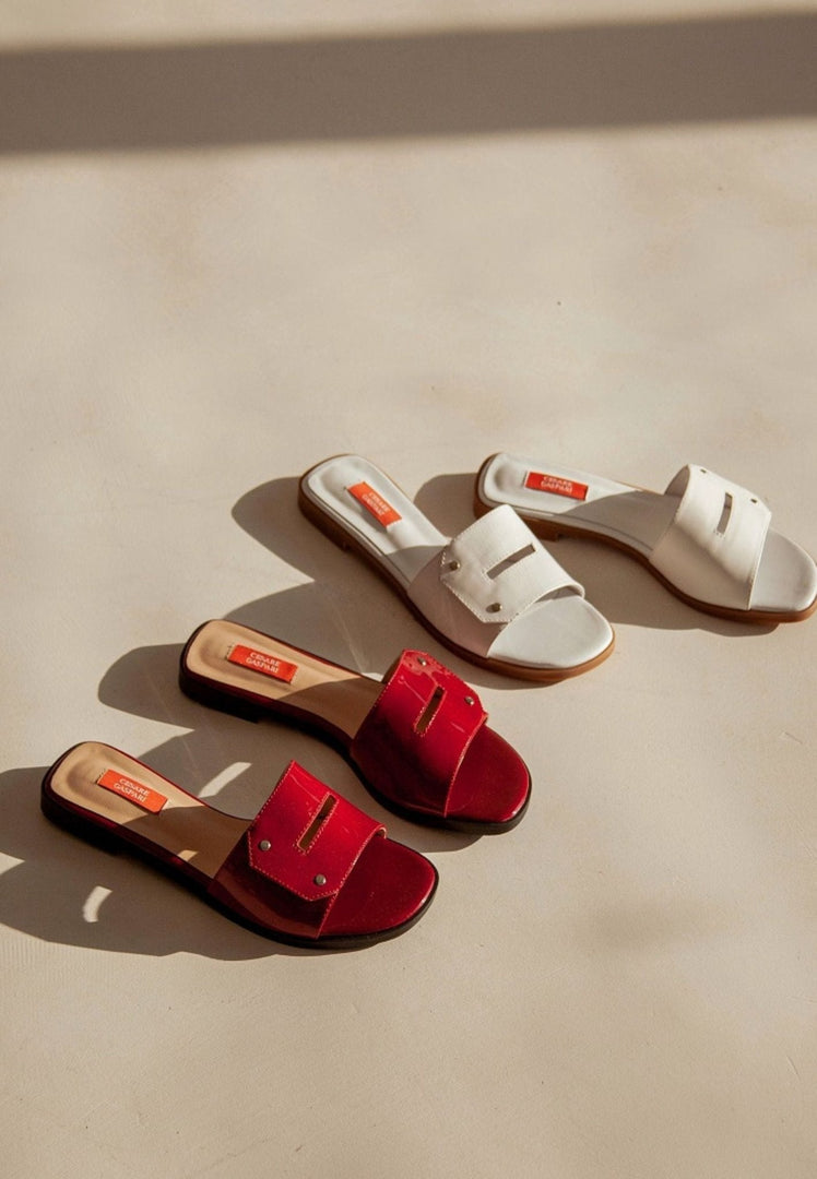A pair of elegant white chic sandals, a trendy and fashionable choice for any outfit.