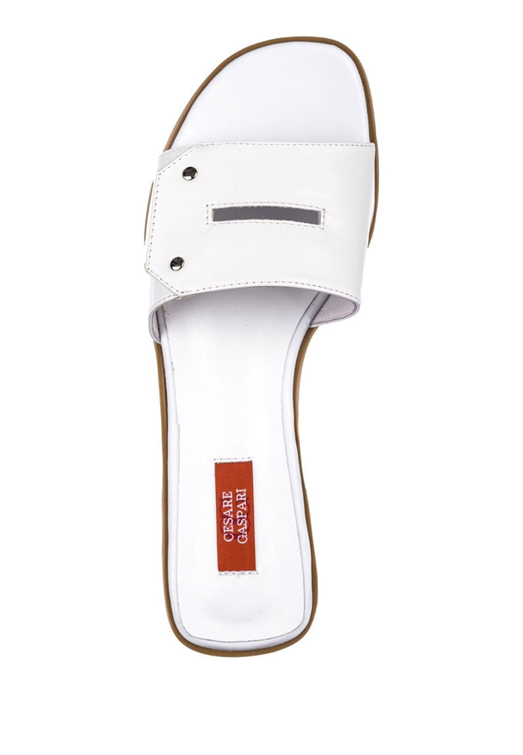 A close-up image of a pair of elegant white sandals, perfect for a chic and stylish look.