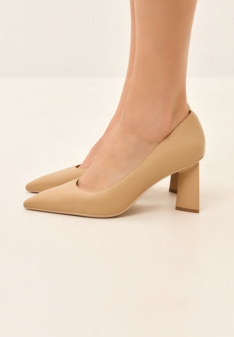 A pair of trendy beige block heel pumps known as Silvia beige pumps, perfect for women's fashion.
