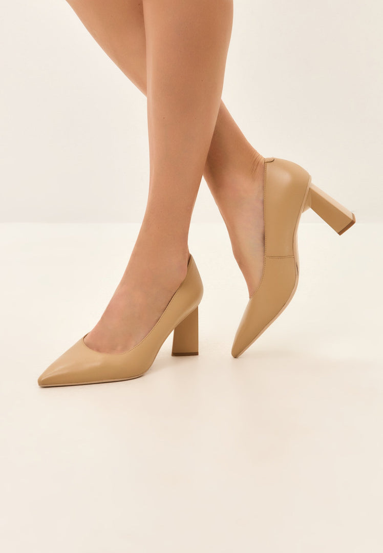 A stylish pair of Silvia beige block heels pumps for women, the perfect blend of fashion and comfort for a trendy look.