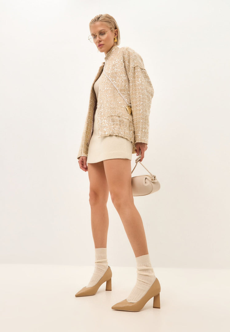 A stylish pair of trendy beige block heel pumps known as Silvia beige pumps for women.