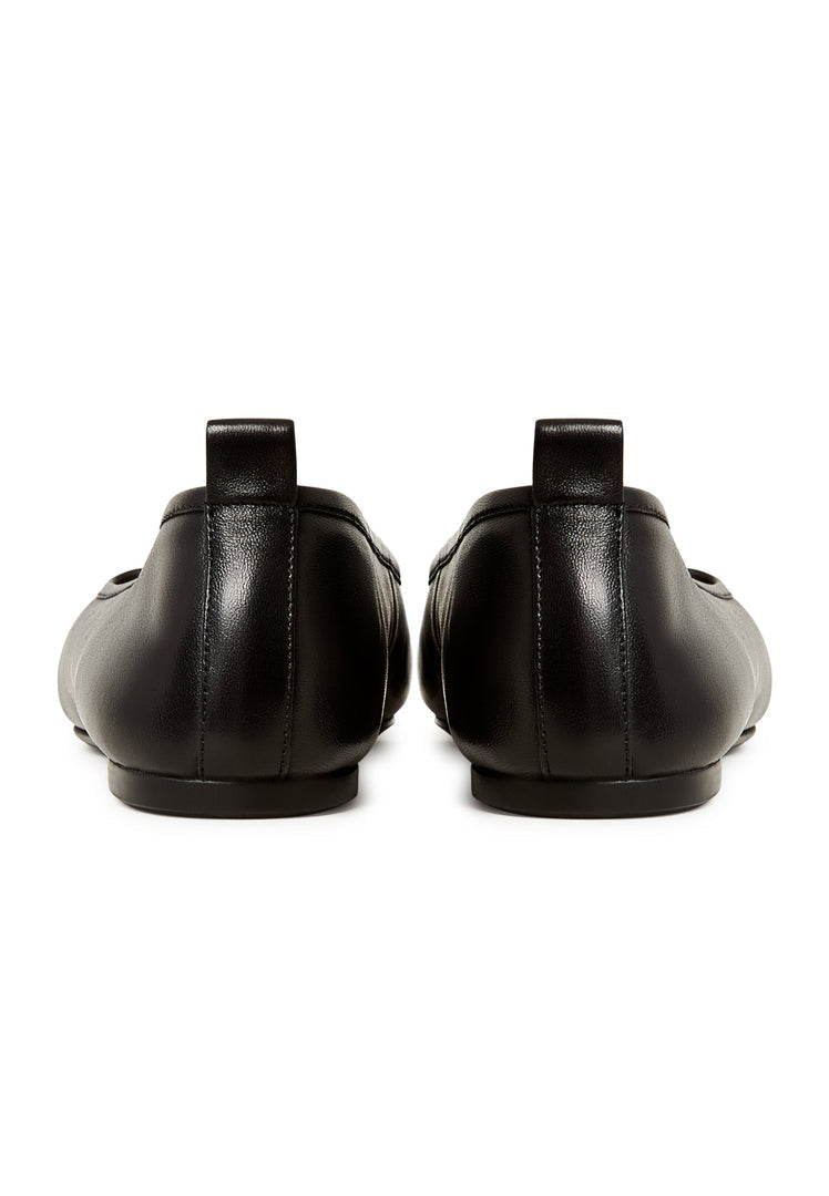 A close-up image of stylish black patent leather ballerinas, the Mila ballerinas, perfect for women looking for comfortable and chic black patent flats.