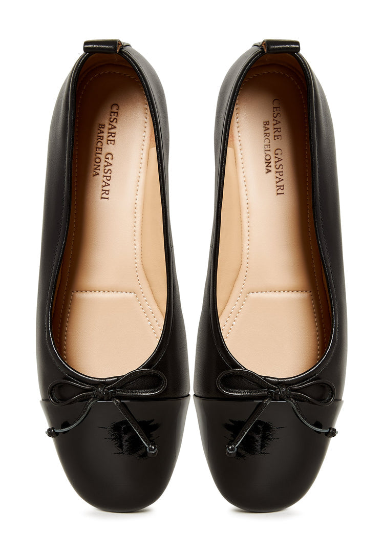A stylish pair of women's leather black patent ballerinas, the Mila ballerinas, perfect for a classic and sophisticated look.