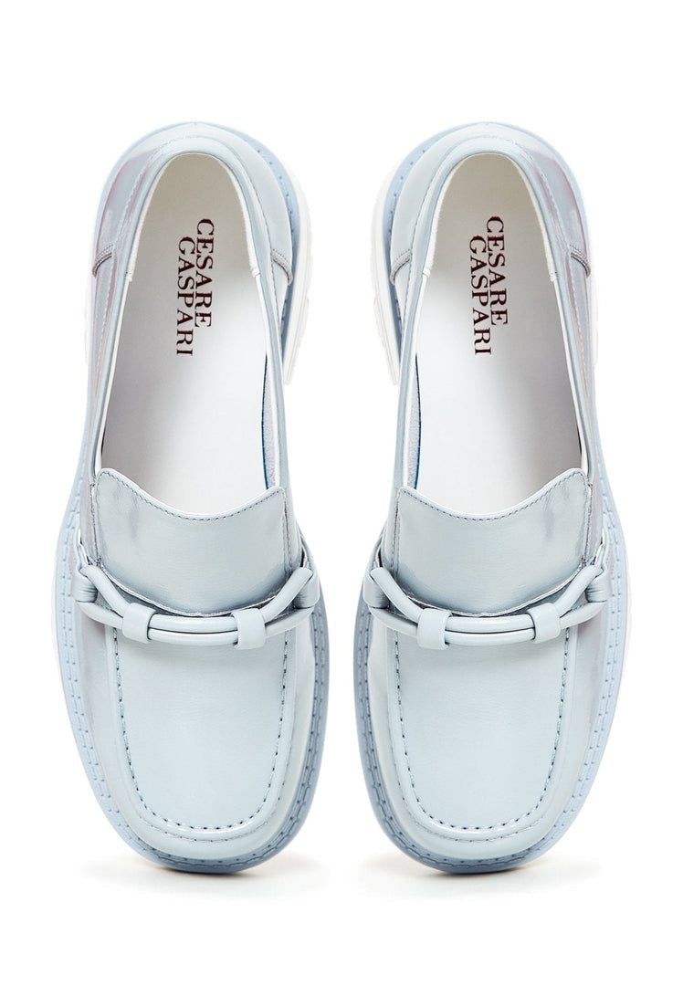 A fashionable pair of women's blue block heels loafers, perfect for any stylish outfit.