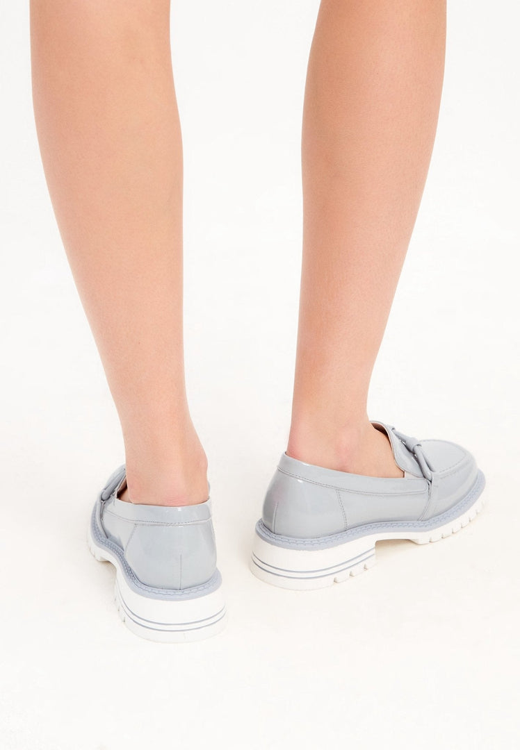 A stylish pair of women's block heels blue loafers, perfect for fashion-forward individuals looking for trendy blue shoes.