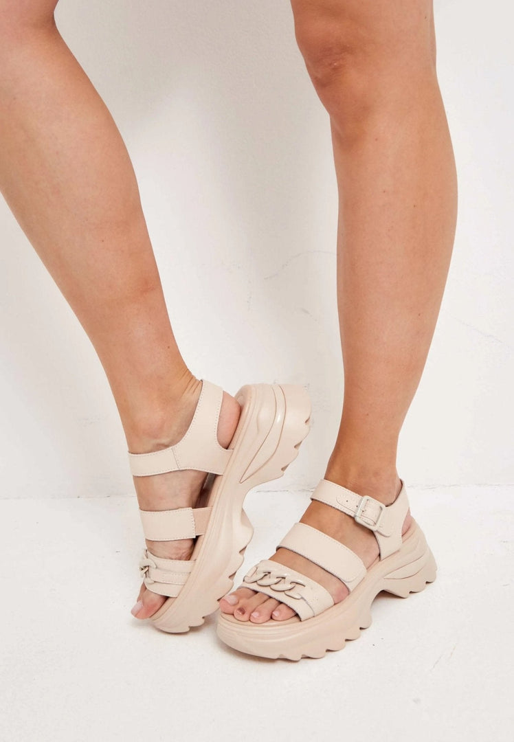 Stylish women's leather platform sandals with high heels for a chic and trendy look.