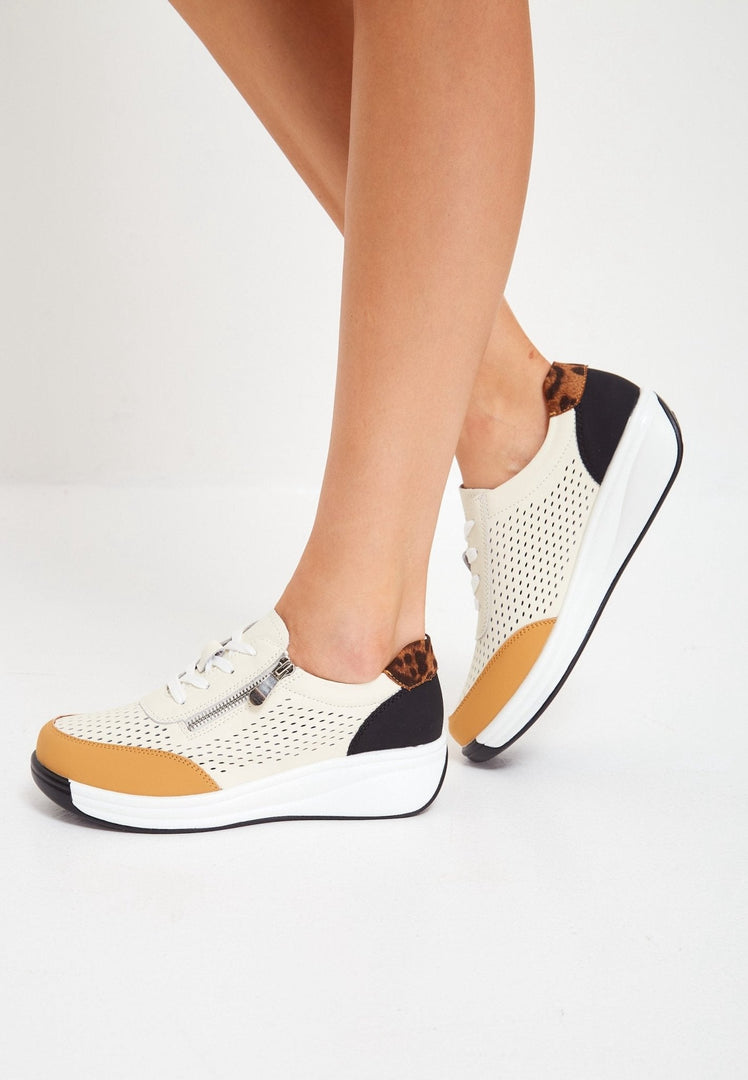 A pair of stylish women's brown leather platform sneakers, perfect for a fashionable and trendy footwear look.