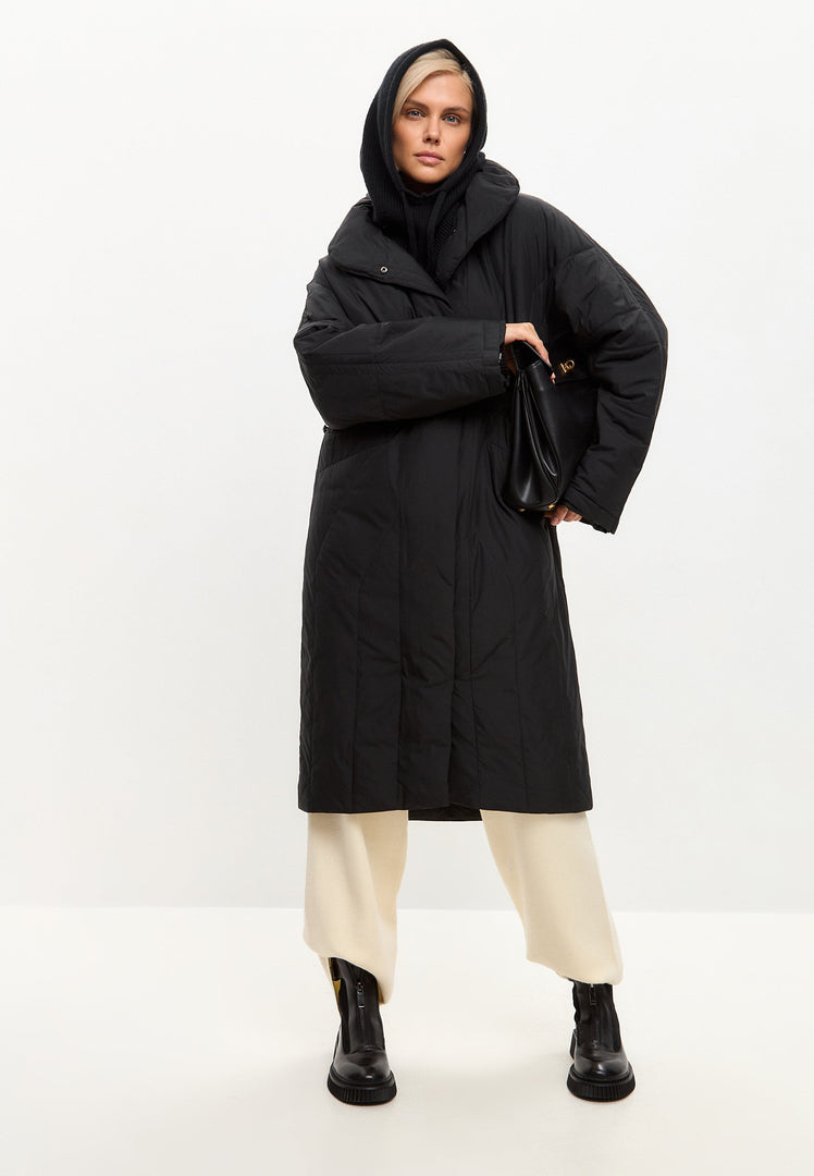 A stylish black quilted coat for women, perfect for winter outerwear.