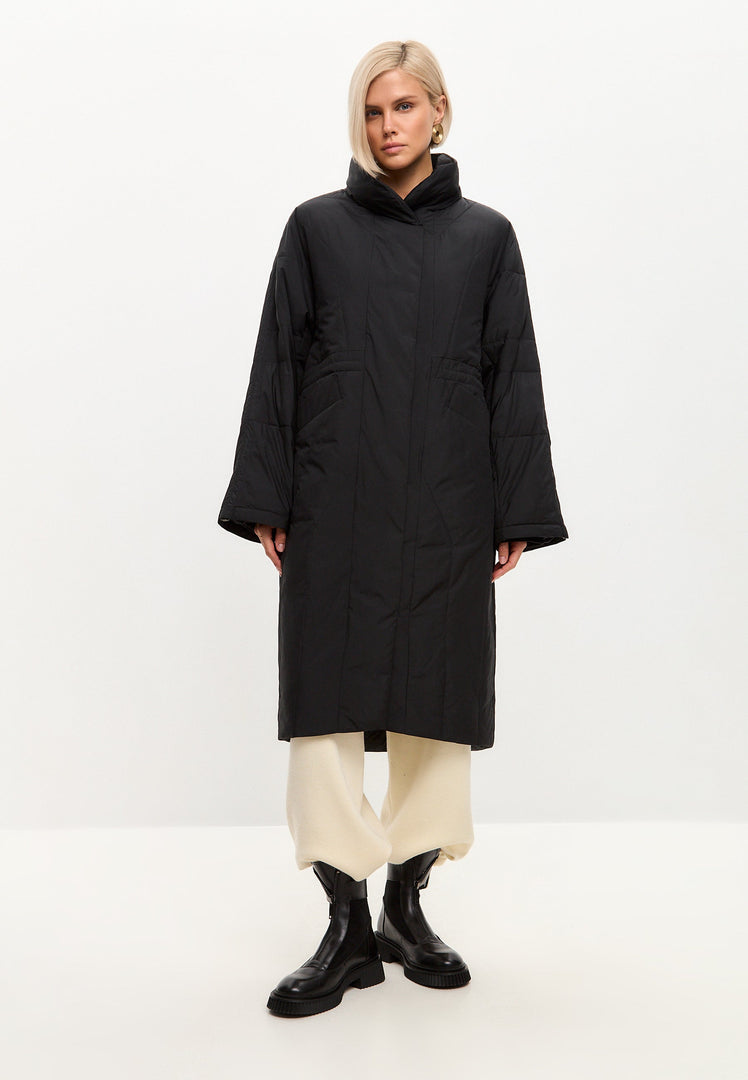 A fashionable black quilted coat for women, perfect for winter outerwear, featuring a long and stylish design.