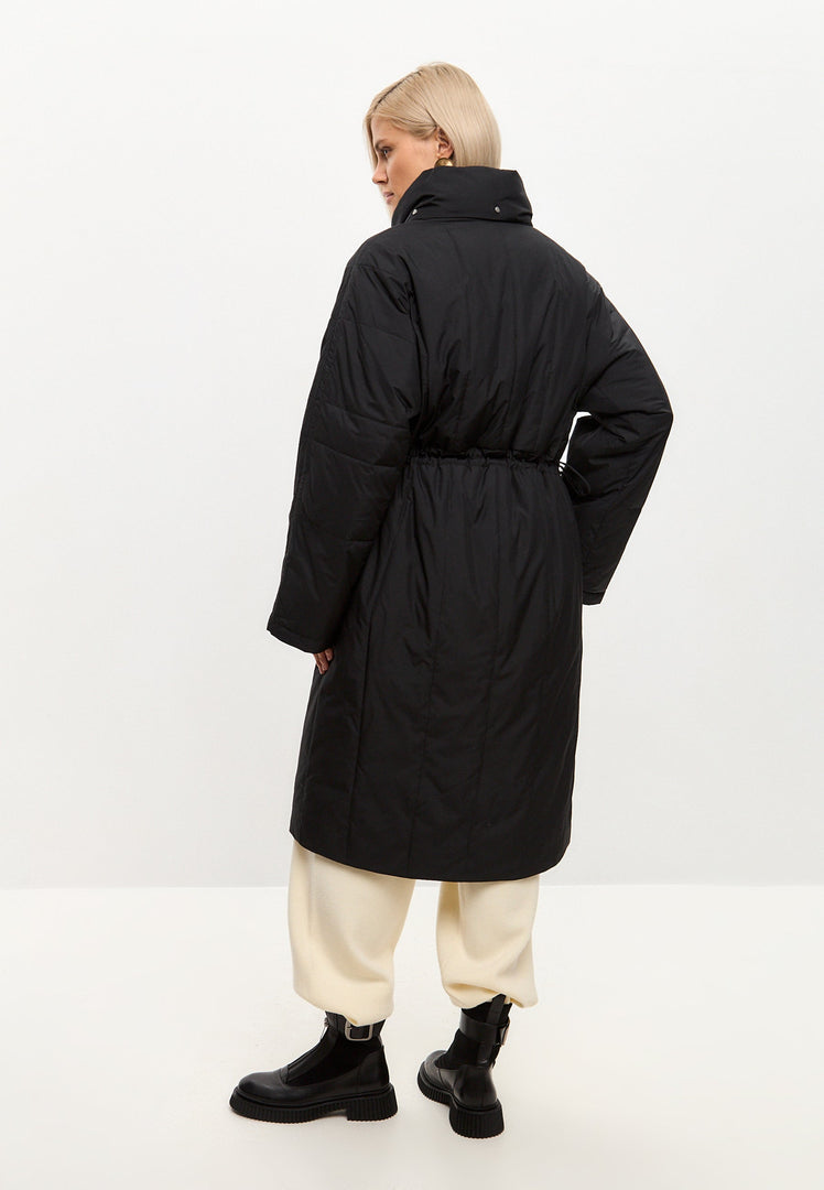 A stylish black quilted long coat for women, perfect for winter outerwear and a fashionable look.