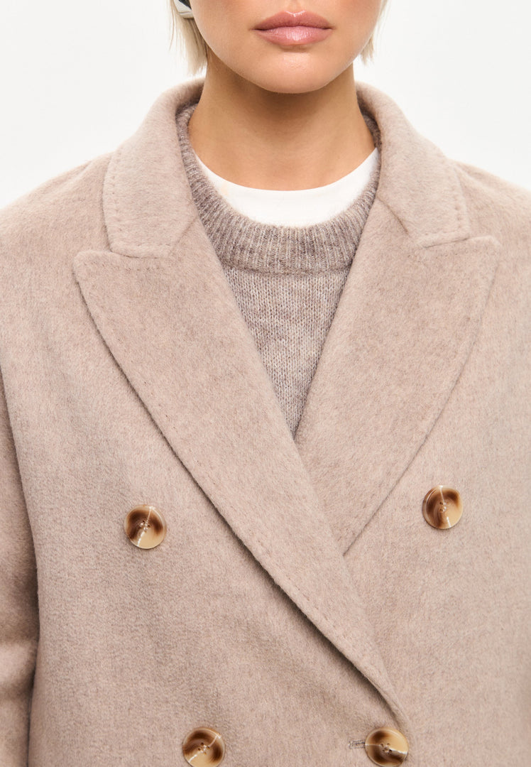 A stylish long coat for women named Rosie, featuring a classic luxe design with pearl detailing, perfect for winter fashion.