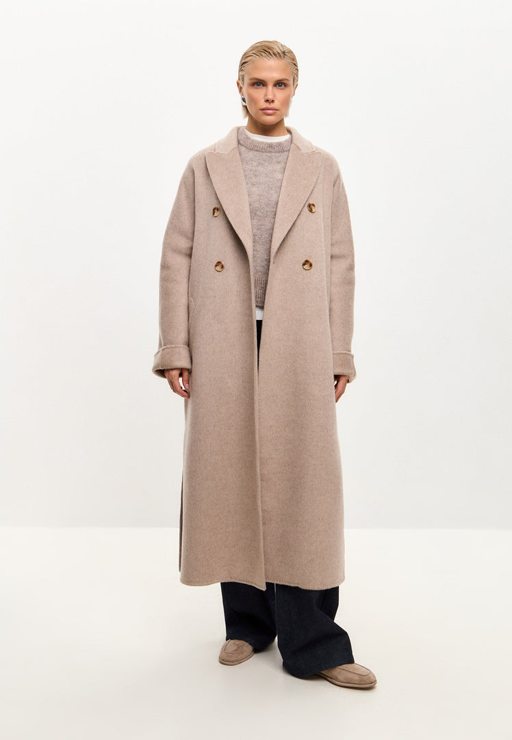 A stylish long coat Rosie in a classic luxe design with pearl accents, perfect as a winter fashion coat for women.