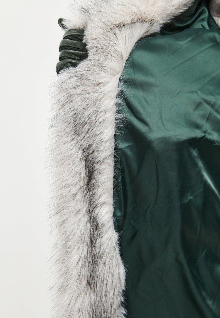 A stylish woman wearing a luxurious gray faux fur coat, the perfect winter fashion statement for women's faux fur jackets.