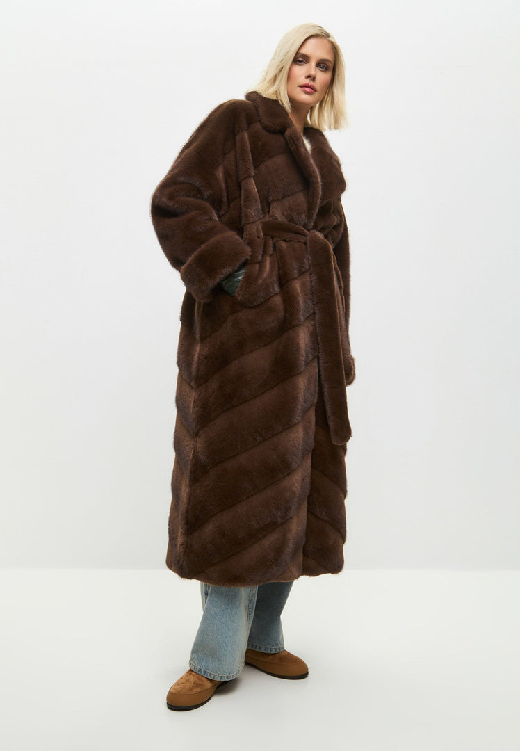 A stylish and trendy oversized brown faux fur coat for women, perfect for winter fashion and making a statement.