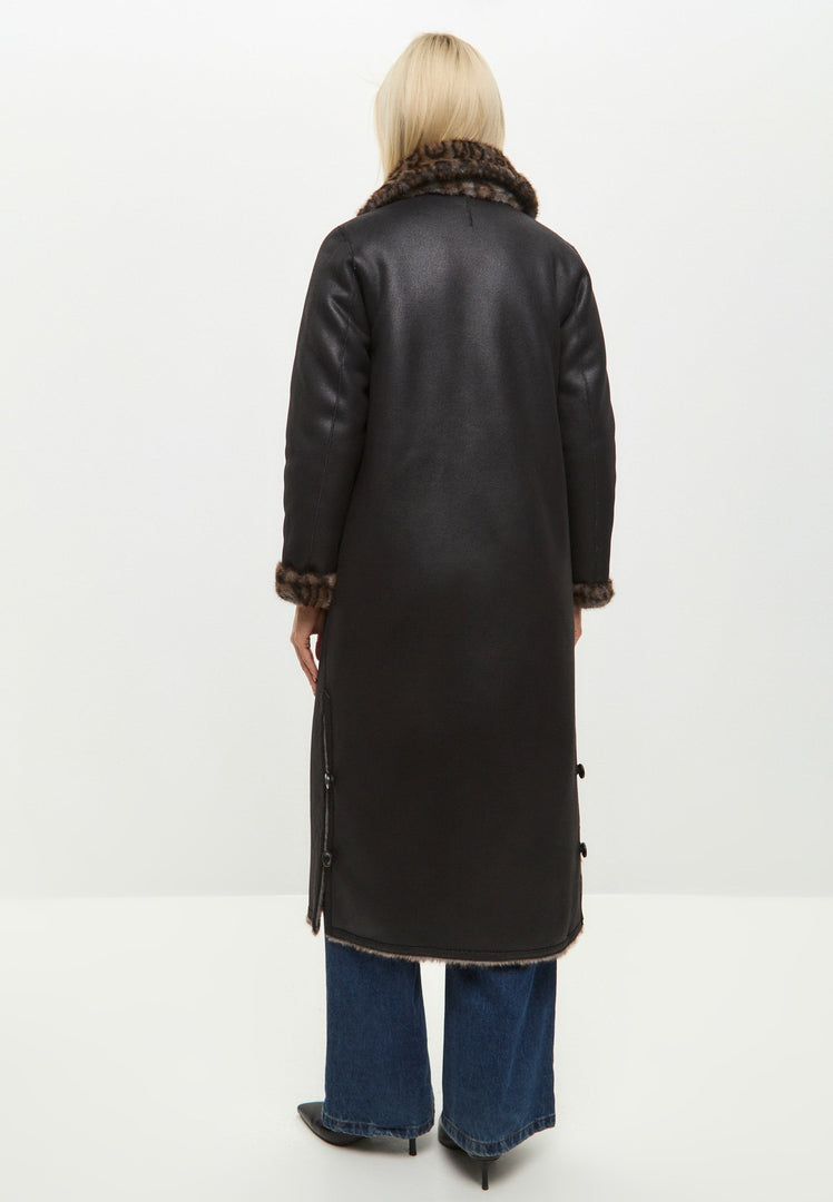 A stylish and cozy faux shearling animal print coat, featuring a reversible design, perfect as trendy winter outerwear.