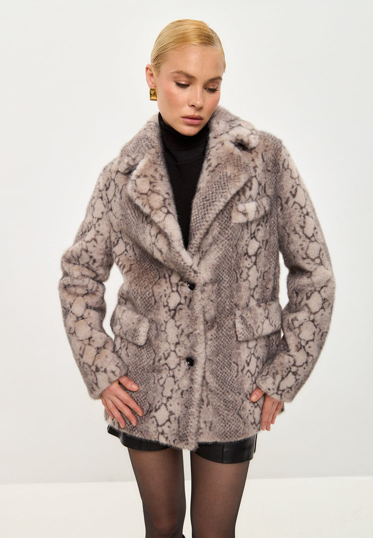 A trendy Niuvis beige faux fur coat with snake print design, perfect for stylish outerwear in the latest winter fashion trends.