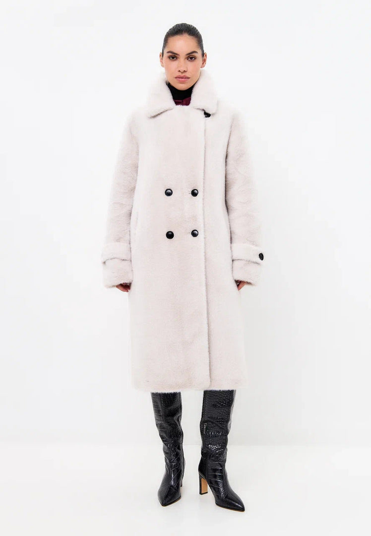 Stay warm and stylish this winter with the Miriam double-buttoned faux fur white coat, a must-have for your winter fashion collection.