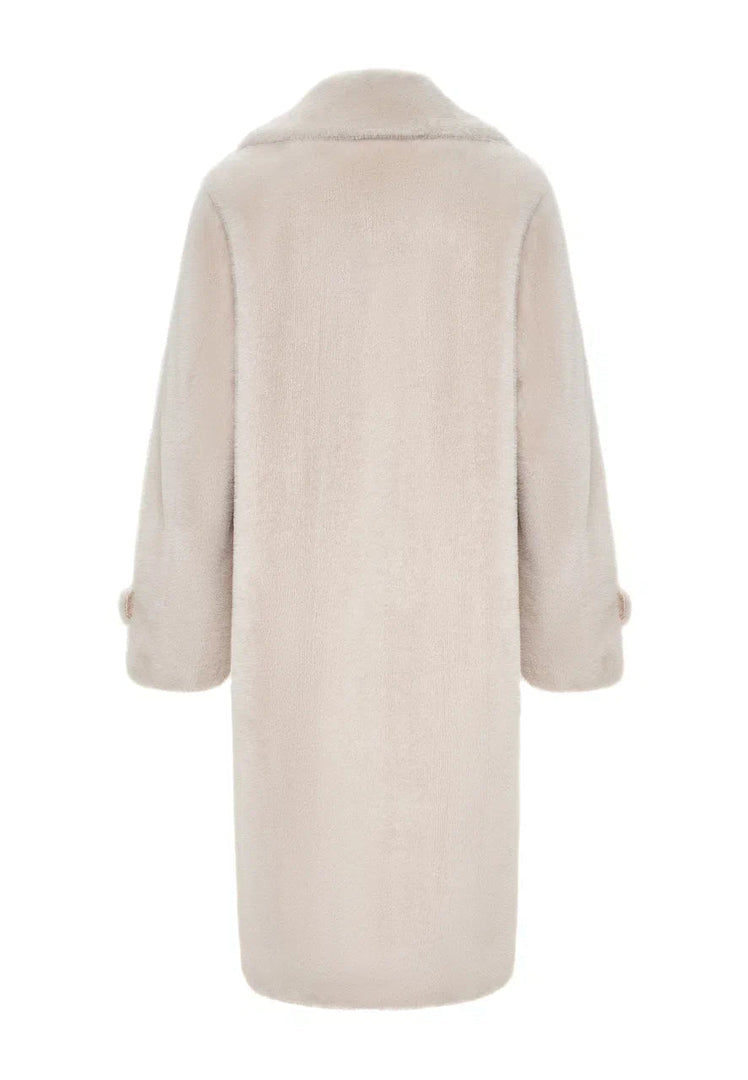 A stylish winter fashion coat in white, the Miriam coat featuring double buttons and faux fur trim.