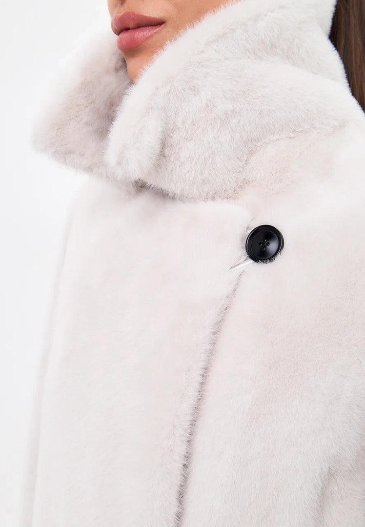 Stay warm and stylish this winter with the Miriam double-buttoned faux fur coat in white - the perfect addition to your winter fashion collection.