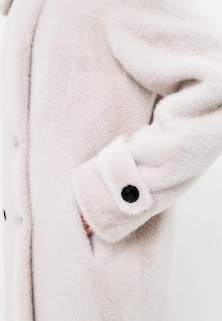A stylish white faux fur Miriam coat with double buttons, perfect for winter fashion.