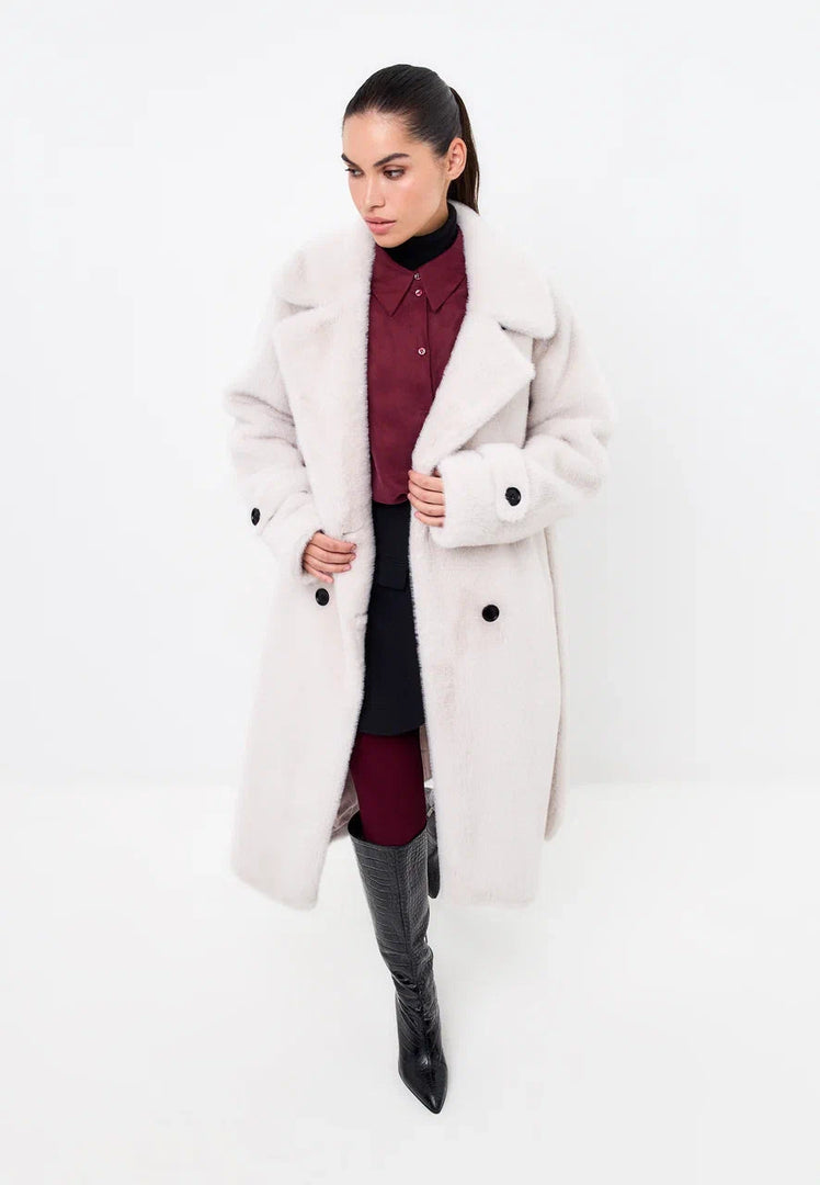 Stay classy this winter with the Miriam double-buttoned faux fur white coat, your go-to fashion statement for the season.