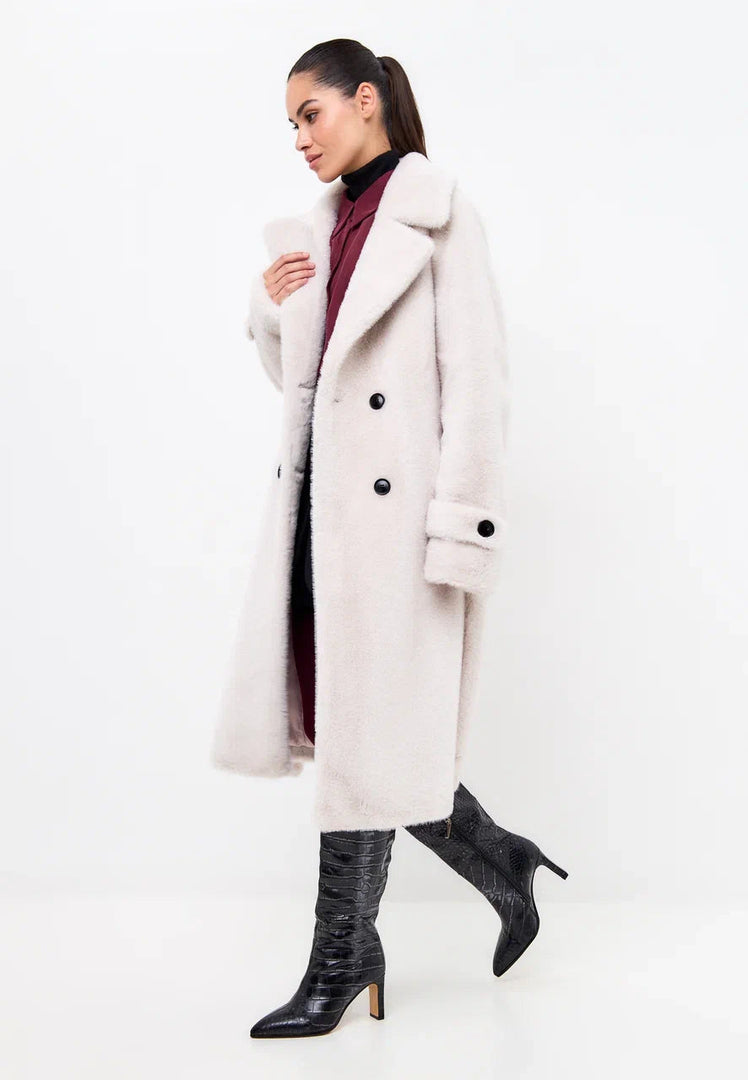 Stay warm and stylish this winter with the Miriam double-buttoned faux fur white coat - the perfect addition to your winter fashion wardrobe.